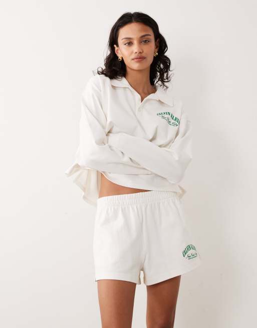 Calvin Klein - Pantaloncini in jersey color crema con logo in coordinato