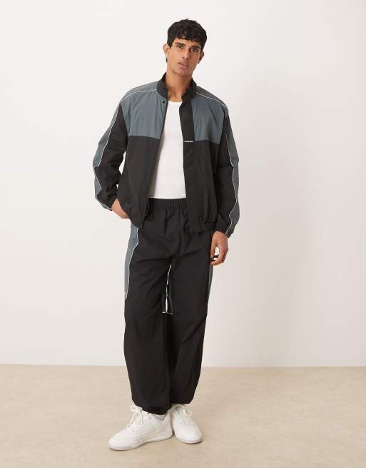 Calvin Klein Performance color block tracksuit set in black & gray
