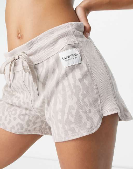 Calvin Klein Performance logo curved hem shorts in beige