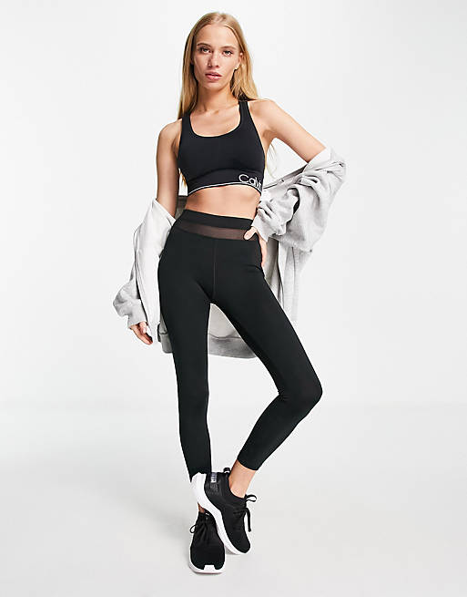 Calvin Klein Performance medium impact v-neck racerback seamless sports bra  with removable cups in black | ASOS