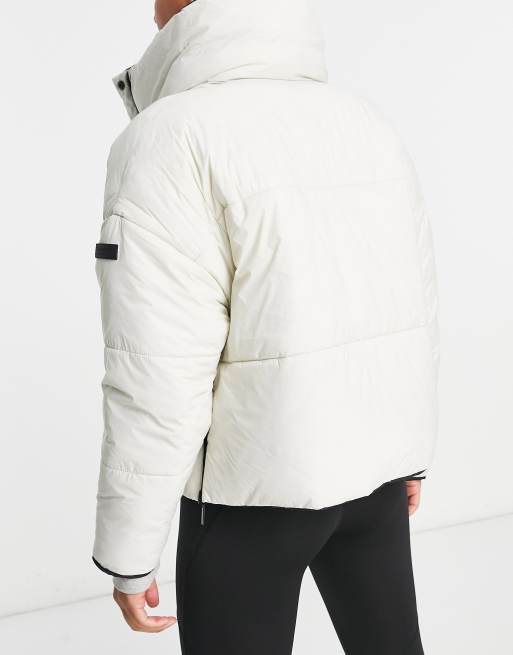 Calvin Klein Performance reversible oversized puffer coat in black/off white