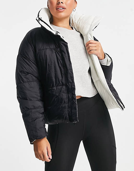 Smaak Ontwijken contant geld Calvin Klein Performance reversible oversized puffer coat in black/off white  | ASOS