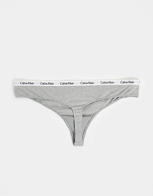 Calvin Klein Plus Size Carousel thong 3 pack in grey, coral and cyber green  | ASOS