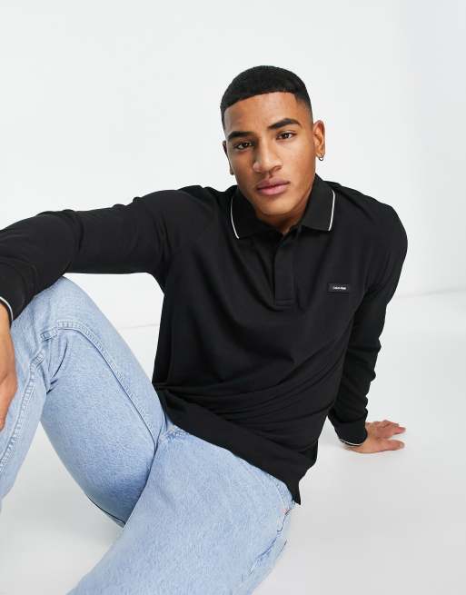 Calvin Klein - Polo in piqué di misto cotone elasticizzato nera con logo e bordi a contrasto 