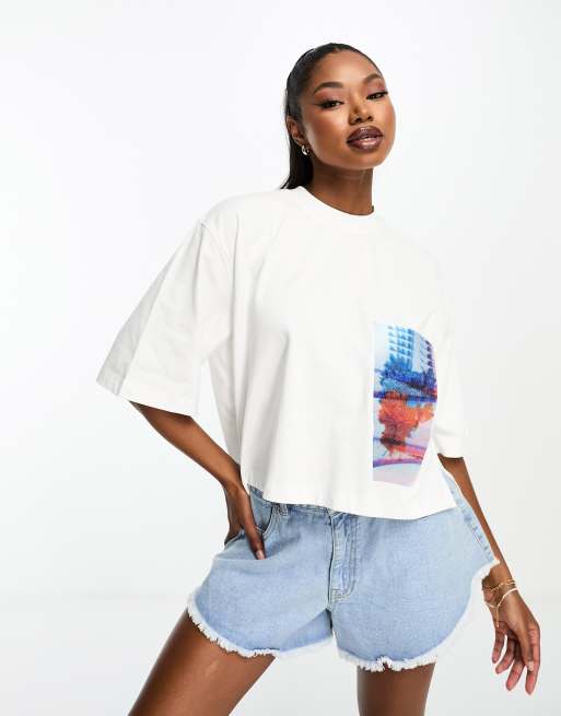 Calvin Klein relaxed fit t shirt with floral pocket detail in white
