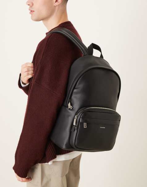 Calvin Klein round backpack with front pocket in black - view 1