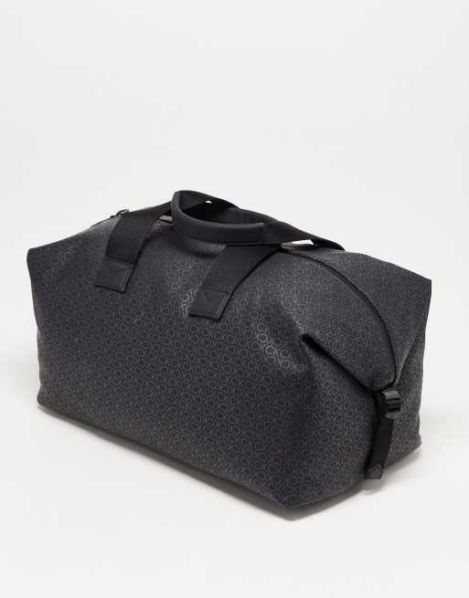 Calvin Klein rubberized monogram weekend bag in black ASOS