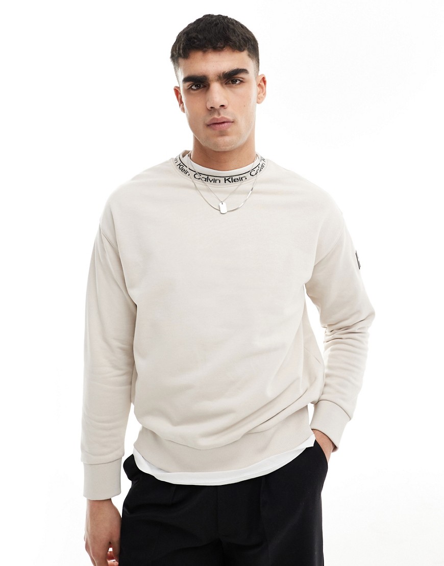 Calvin Klein running logo comfort sweatshirt in beige - exclusive to ASOS-Black