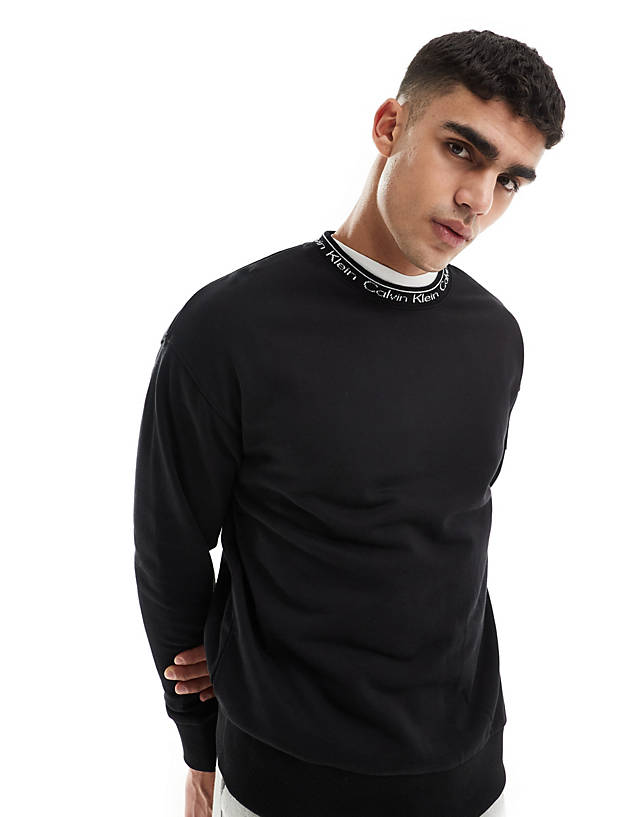 Calvin Klein - running logo comfort sweatshirt in black - exclusive to asos