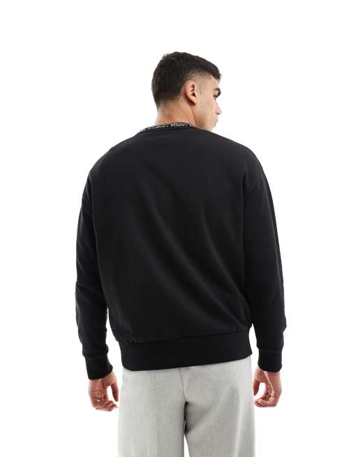 Calvin Klein running logo comfort sweatshirt in black exclusive to ASOS