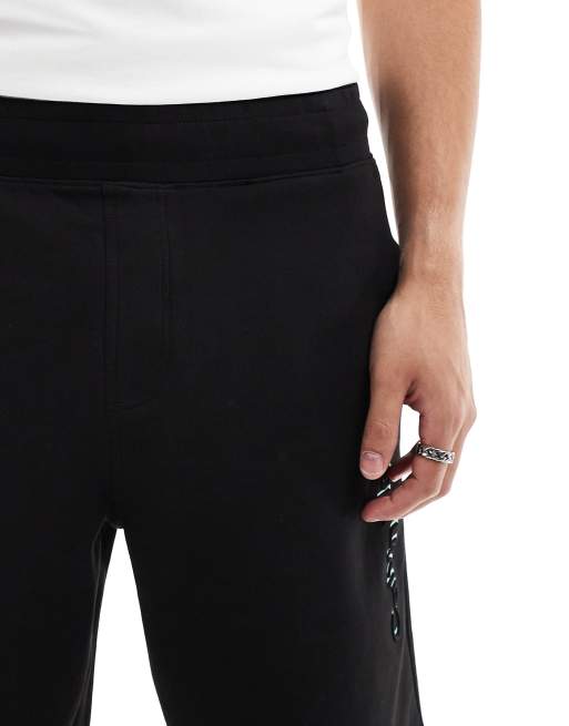 Calvin Klein shadow embossed logo jersey shorts in black, 5 of 5