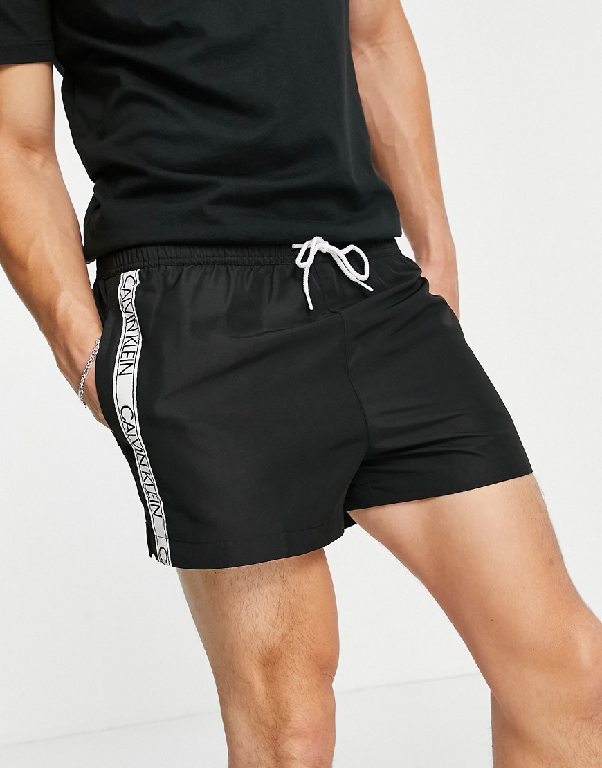 Calvin Klein short drawstring swim shorts with logo taping in black
