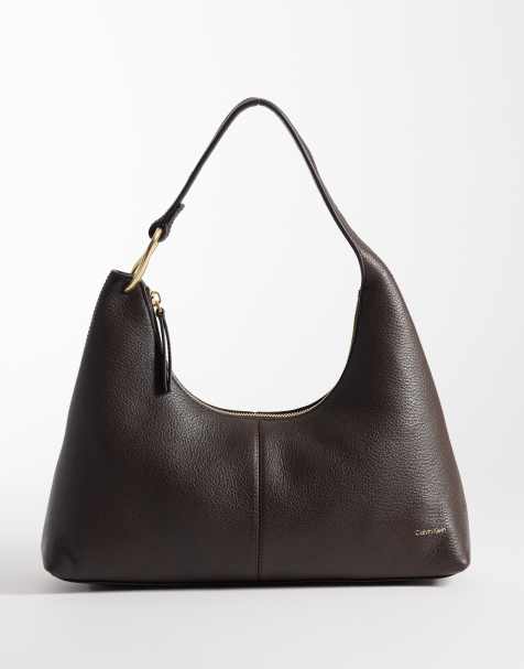 Calvin Klein slouchy leather shoulder bag with gold details in chocolate brown - view 1