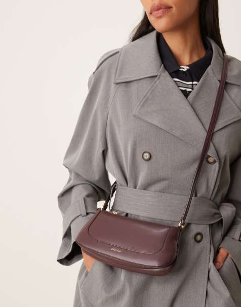 Calvin Klein small cross body purse in brown - view 1