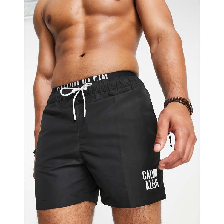 Calvin Klein small thigh logo swim shorts in black