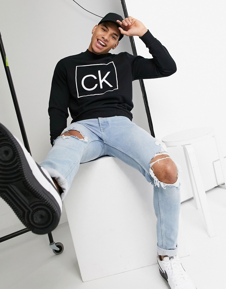Calvin Klein - Svart sweatshirt med mock-krage och logga fram och bak