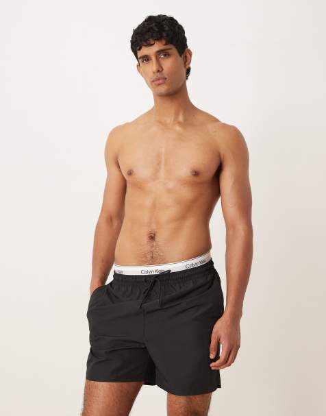 Calvin Klein – Svarta badshorts med dragsko och kontrasterande logga på midjebandet - view 1