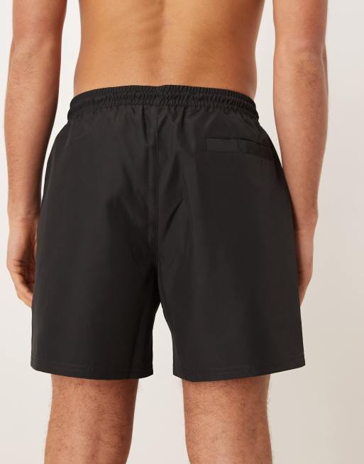Calvin Klein – Svarta badshorts med text på sidan, 5 av 5