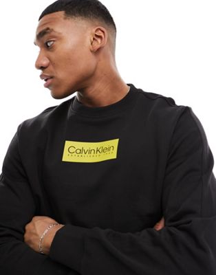 Calvin Klein raised rubber logo sweatshirt in black - ASOS Price Checker
