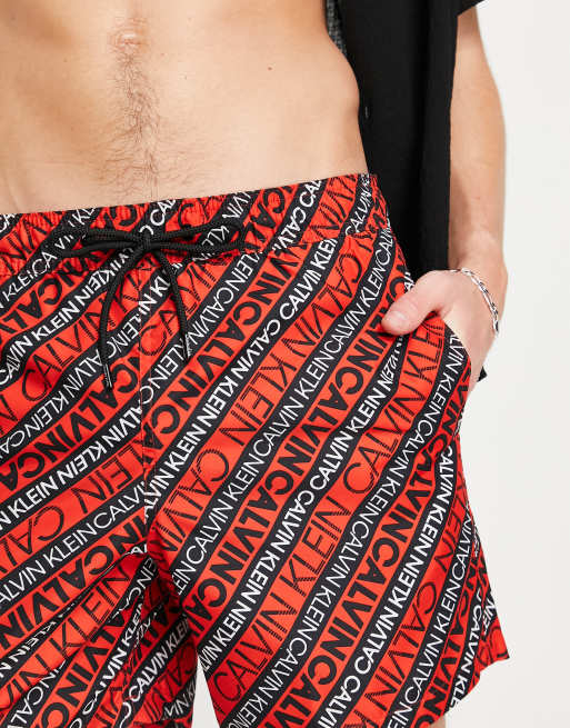 Calvin Klein swim shorts in red logo print