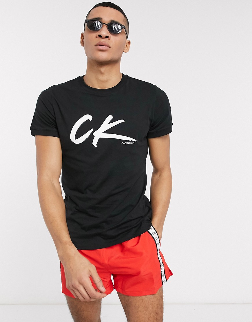 Calvin Klein - T-shirt nera con motivo ondulato rétro e logo-Nero