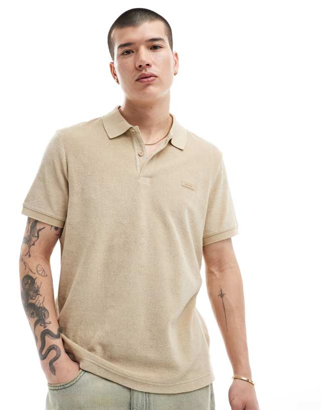 Calvin Klein - towelling polo in tan