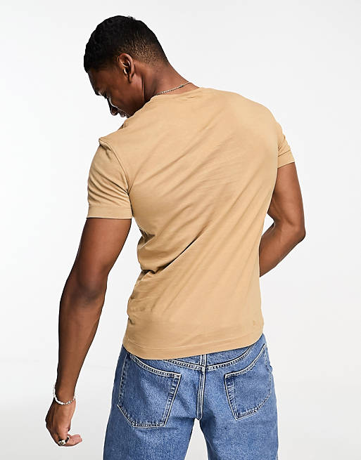 Calvin Klein Unisex Jeans Unisex stacked logo t-shirt in camel | ASOS