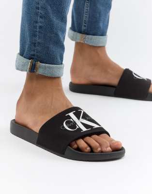 women's black calvin klein sliders