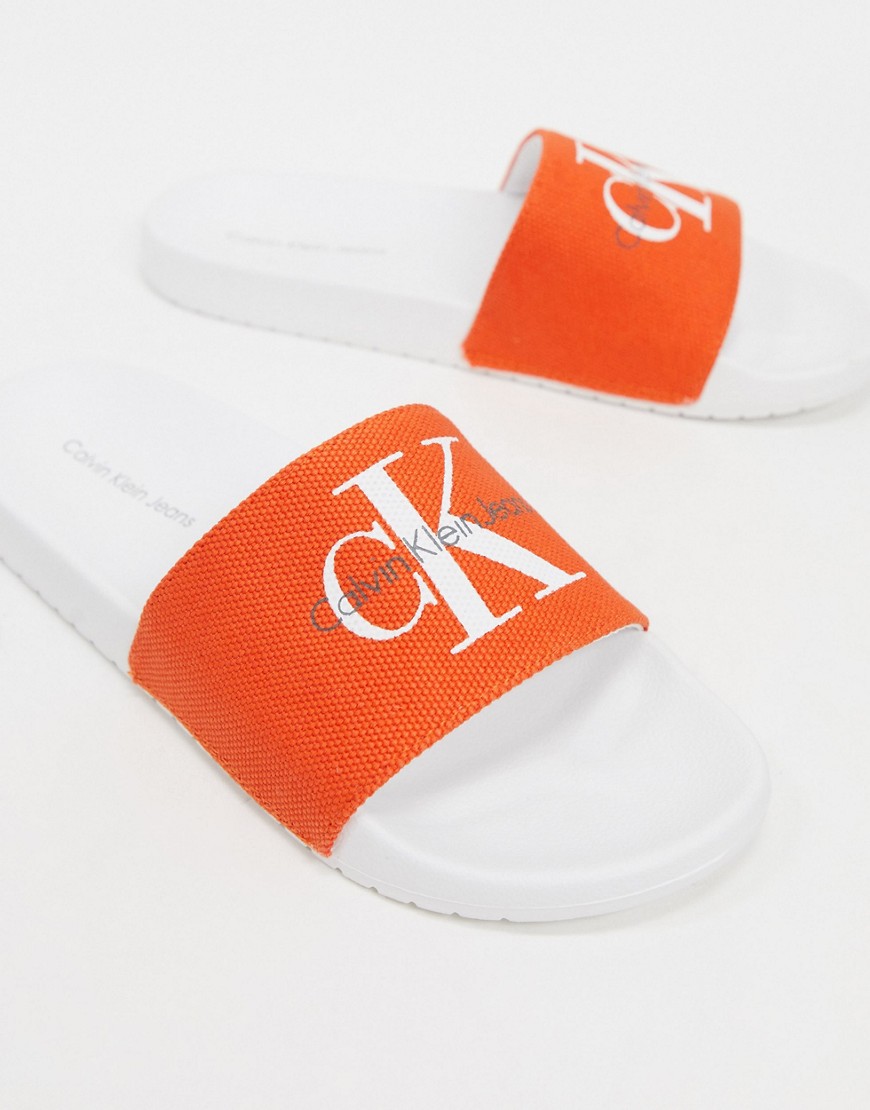 Calvin Klein – Viggo – Orange tofflor med logga