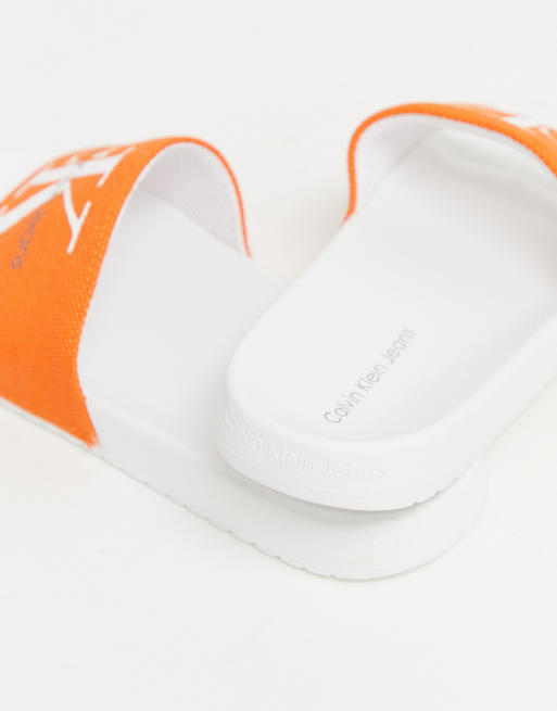 Calvin Klein Viggo sliders in orange ASOS