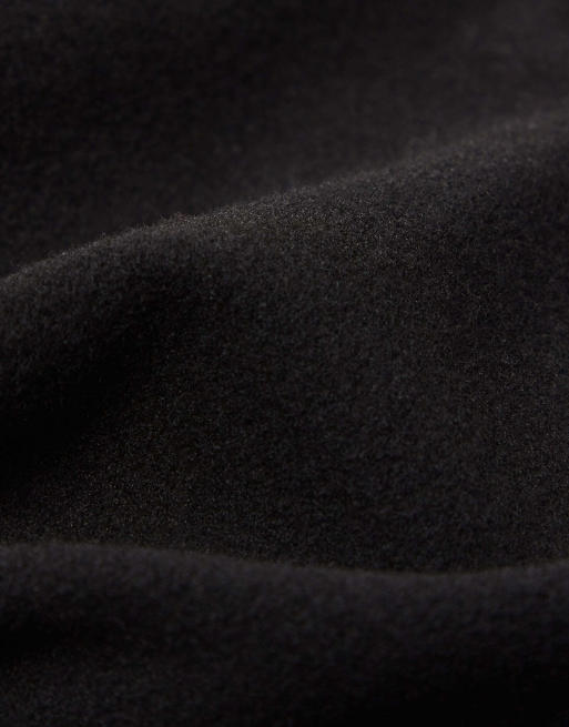 Calzedonia Coated-effect thermal flared trousers in black, 5 of 5