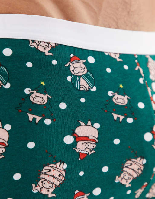 Calzoncillos en verde azulado con estampado navideño de cerdo de ASOS DESIGN