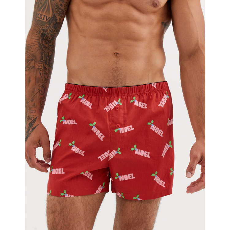 Calzoncillos estilo boxer en tela de navidad en rojo con eslogan de Noel de  ASOS DESIGN