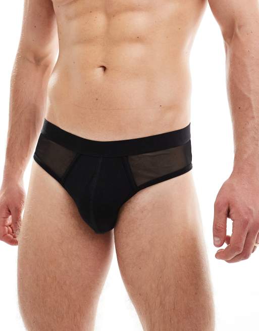 Calzoncillos negros tipo slip con logo en la cinturilla e inserto de malla de ASOS DESIGN