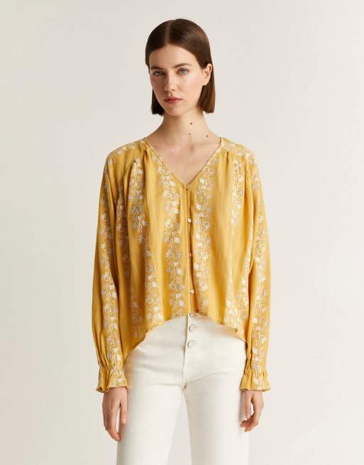 Camisa amarillo mostaza de Scalpers