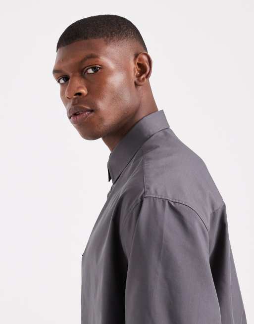 Camisa azul marino lavado extragrande estilo polo de rugby de popelina de ASOS DESIGN, 4 de 5