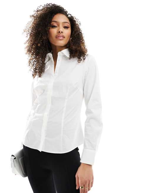 Camisa blanca con cintura entallada de Mango