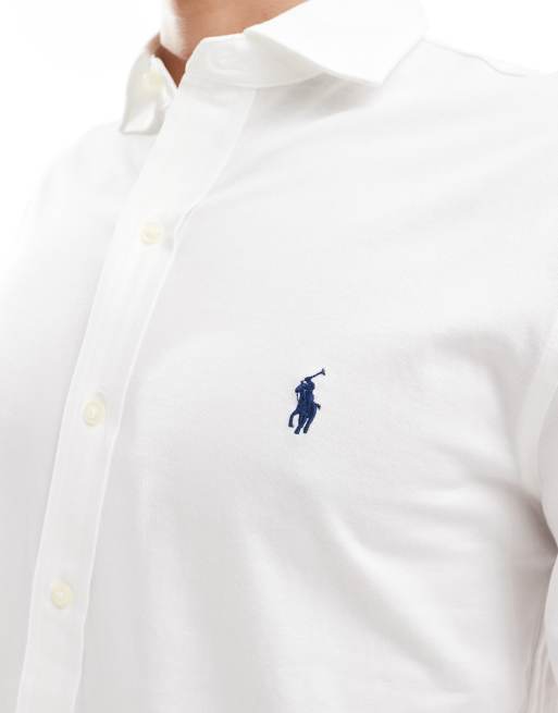 Camisa blanca de estilo casual con solapas y logo de punto de Polo