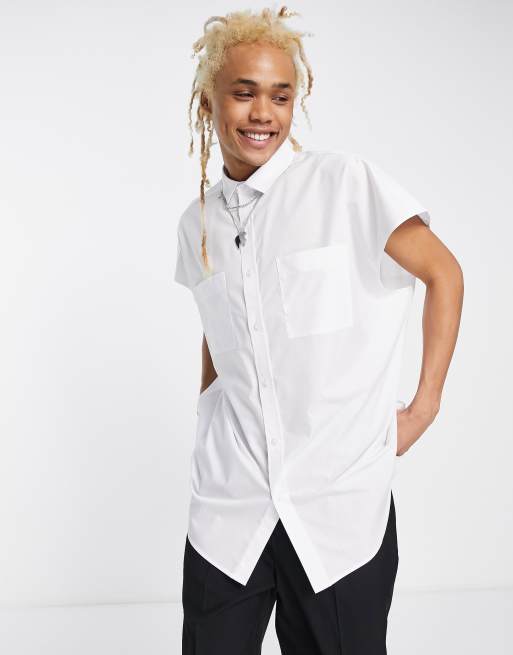 Camisa blanca extragrande sin mangas de ASOS DESIGN ASOS