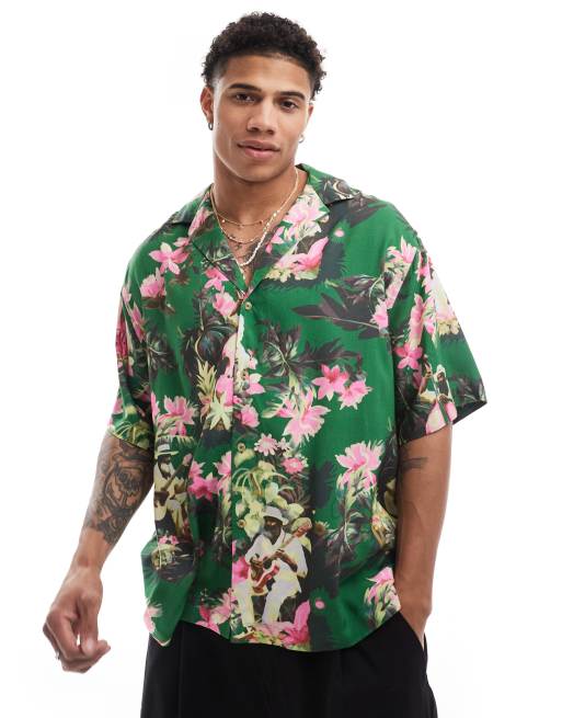 Camisa extragrande con solapas y estampado hawaiano con persona tocando el violonchelo de ASOS DESIGN
