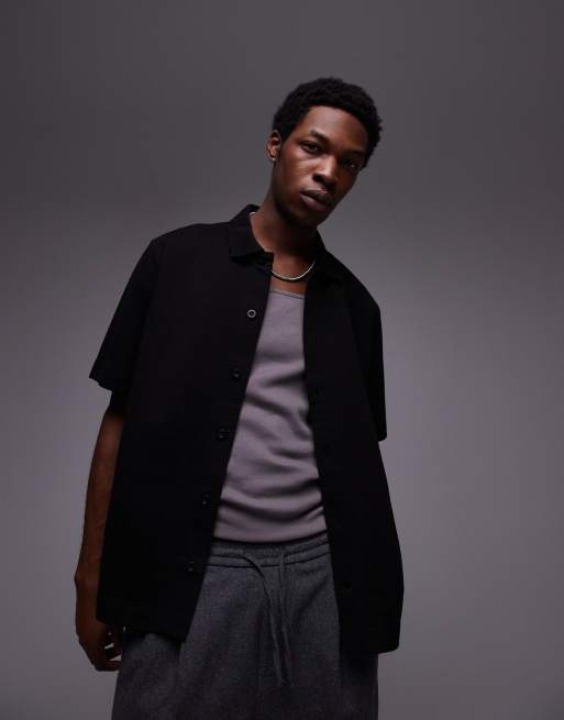 Camisa negra abotonada extragrande de punto liso de Topman