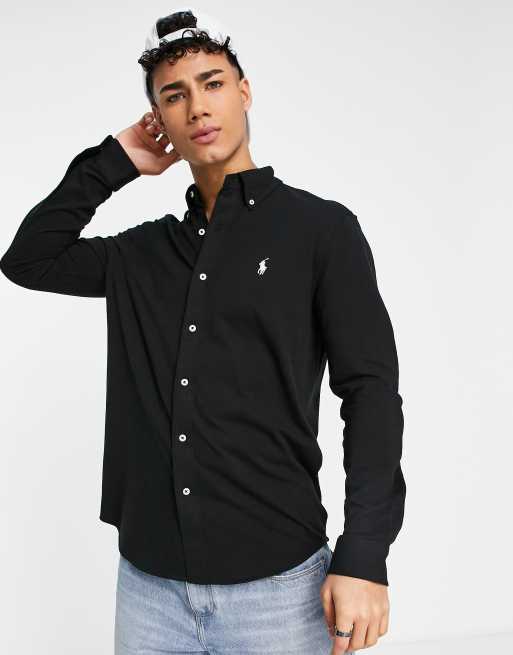 Camisa negra con store botones blancos