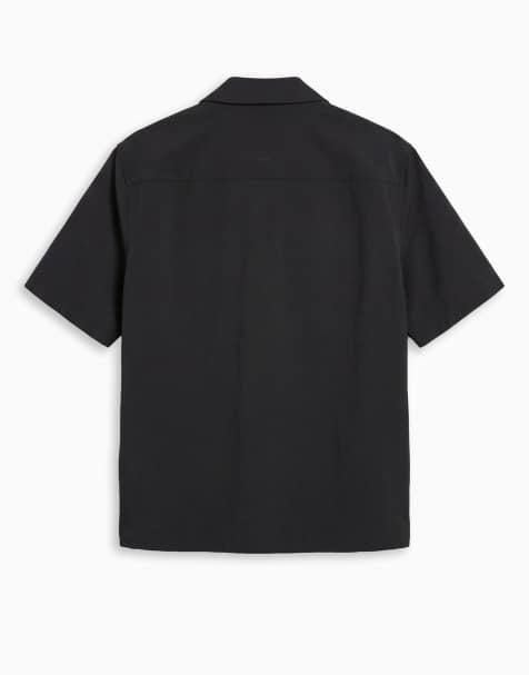 Camisa negra holgada de tejido elástico en cuatro direcciones motionMAX™ de ASOS DESIGN - view 1