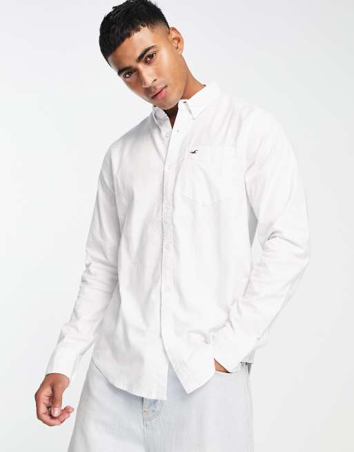 Complacer Museo tratar con Camisa Oxford blanca con bolsillo y logo de Hollister | ASOS