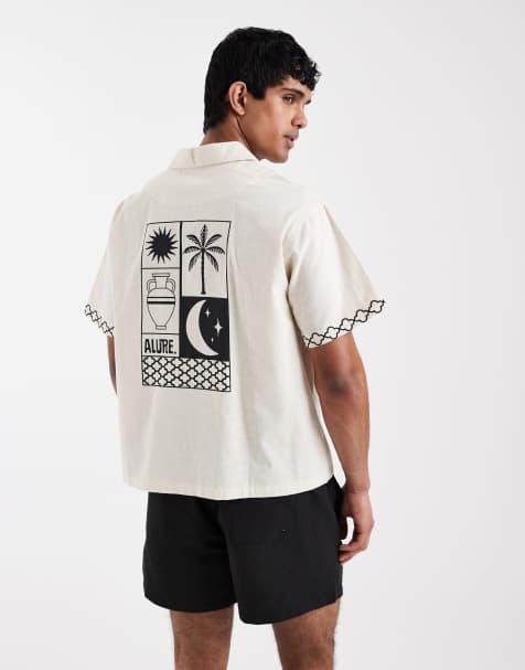 Camisa playera beis con estampado de palmeras en la espalda de Aray - view 1