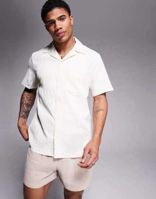 Camisa playera color crema de manga corta de tejido texturizado de South Beach