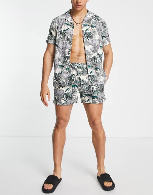 Camisa playera gris claro con estampado de palmeras de Hunky Trunks | ASOS