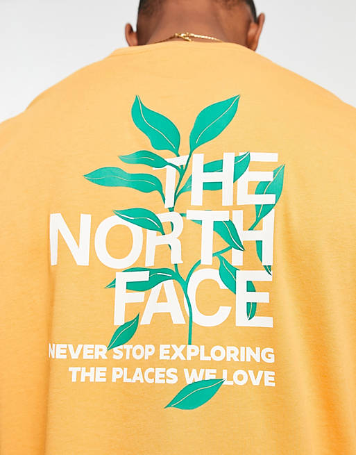 Maravilloso nativo escucho música Camiseta amarilla con estampado gráfico de hojas en la espalda exclusiva en  ASOS de The North Face | ASOS