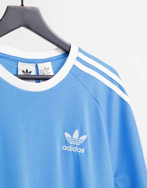 Camiseta azul cielo con tres rayas adicolor de adidas Originals |