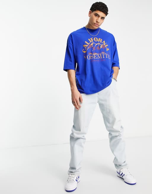 Camiseta azul extragrande con estampado de naturaleza y texto 
